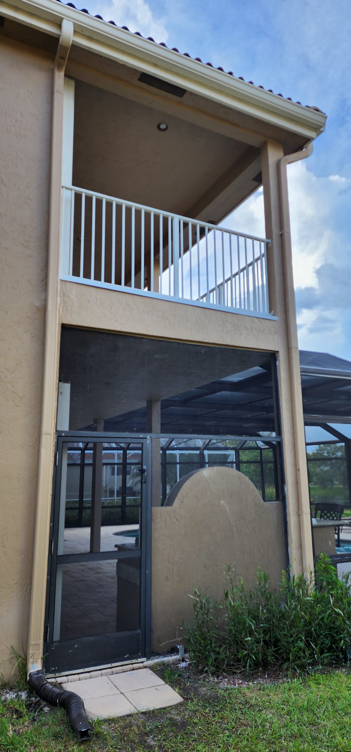 Completed balcony restoration with structural steel repaired and stucco finish matched seamlessly.