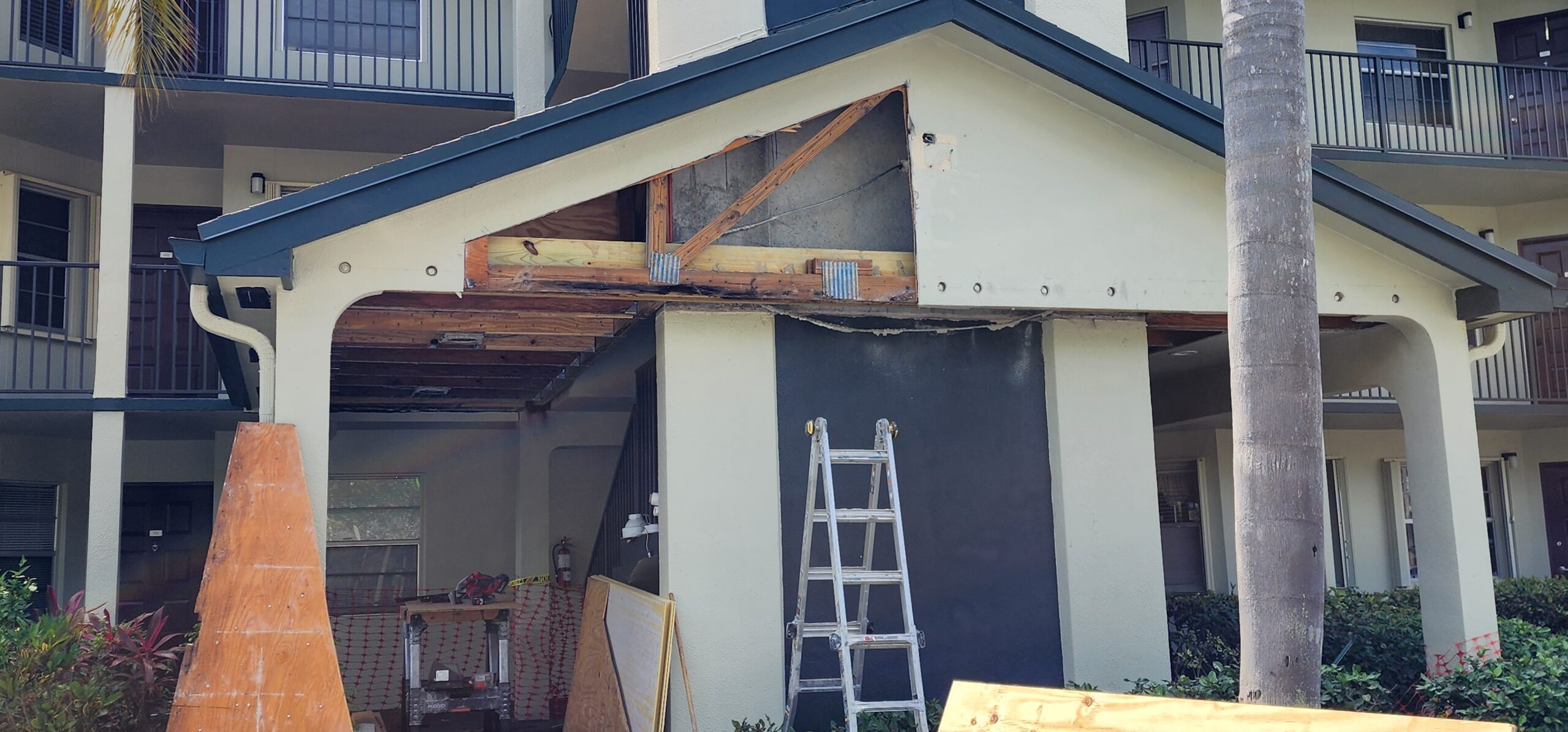 Building exterior with water intrusion damage discovered during 25-year milestone inspection.